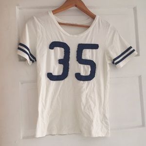 Numbers 35 on it two strips on sleeve